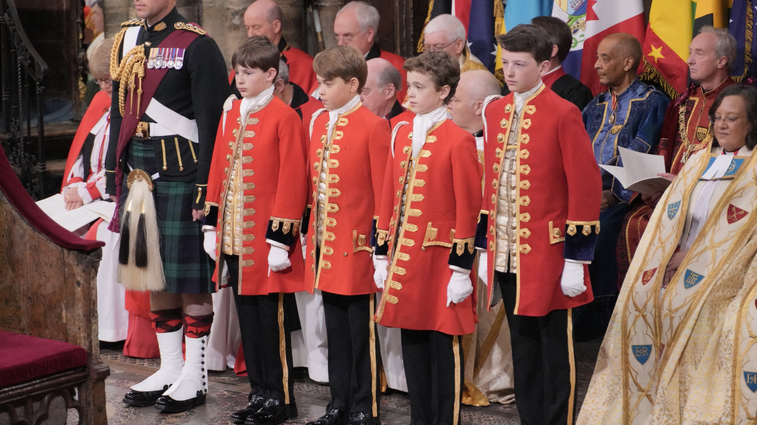 King's Pages, Prince George of Wales (C), Ralph Tollemache (2L), Oliver Cholmondley, and Nicholas Barclay, at Westminster Abbey on May 6, 2023
