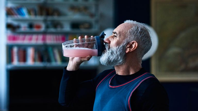 Man drinking a shake made with the best protein Powder for weight loss