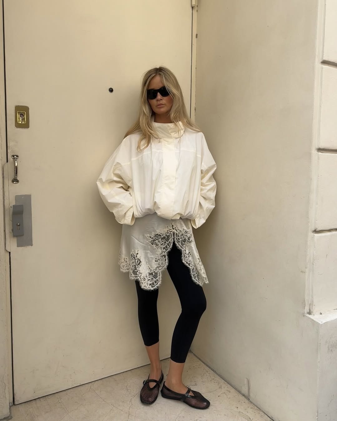 @Josefinehj wearing a funnel neck jacket and Capri leggings