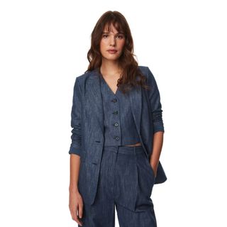 A model wearing a denim look cotton rich suit from M&S