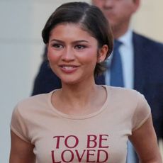 Zendaya wore the graphic tee trend with a lace-trimmed skirt and burgundy loafers