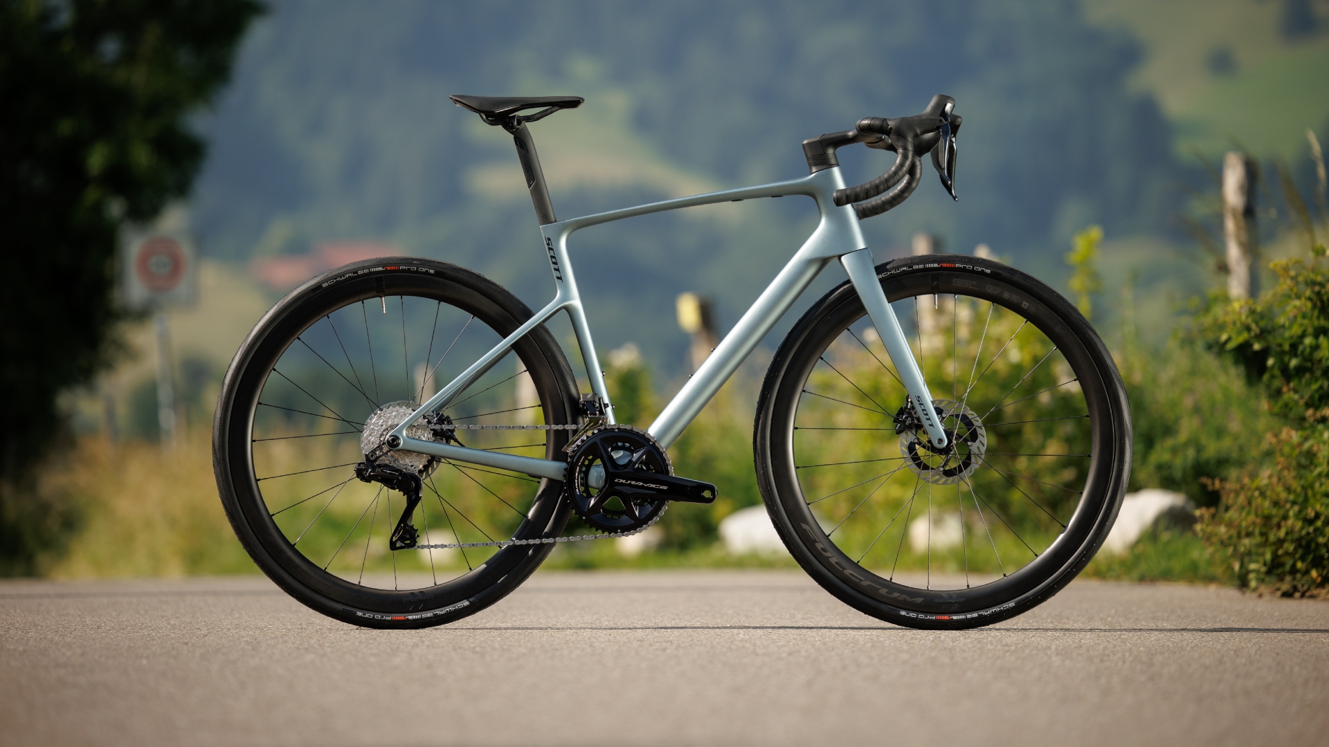 The brand new Scott Addict Premium shown in full side on, on a tarmac road 