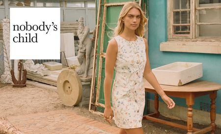 Nobodys child logo top left with a blonde woman in white midi dress 