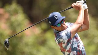 Rickie Fowler hits a drive during the US Open