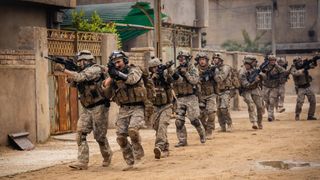 Charles Melton and the cast of Warfare in formation