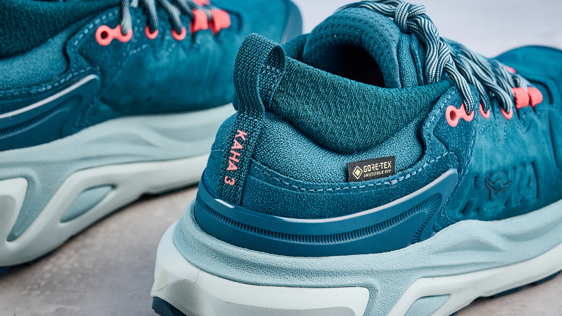 Hoka Kaha 3 Low GTX in droplet colorway photographed in front of a blue background