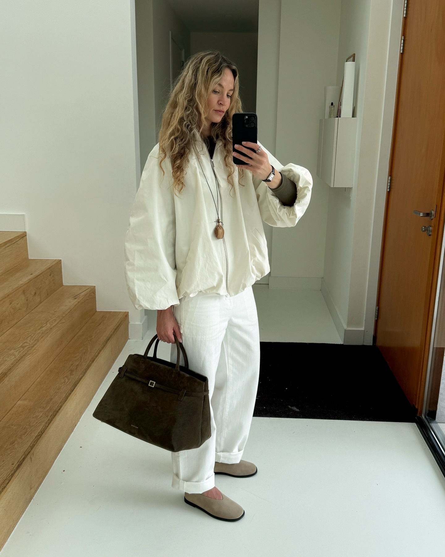 A stylish woman in a technical jacket.