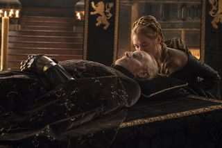 Scene from 'Game of Thrones': Season 5, Episode 1; woman kissing man of forehead at funeral service