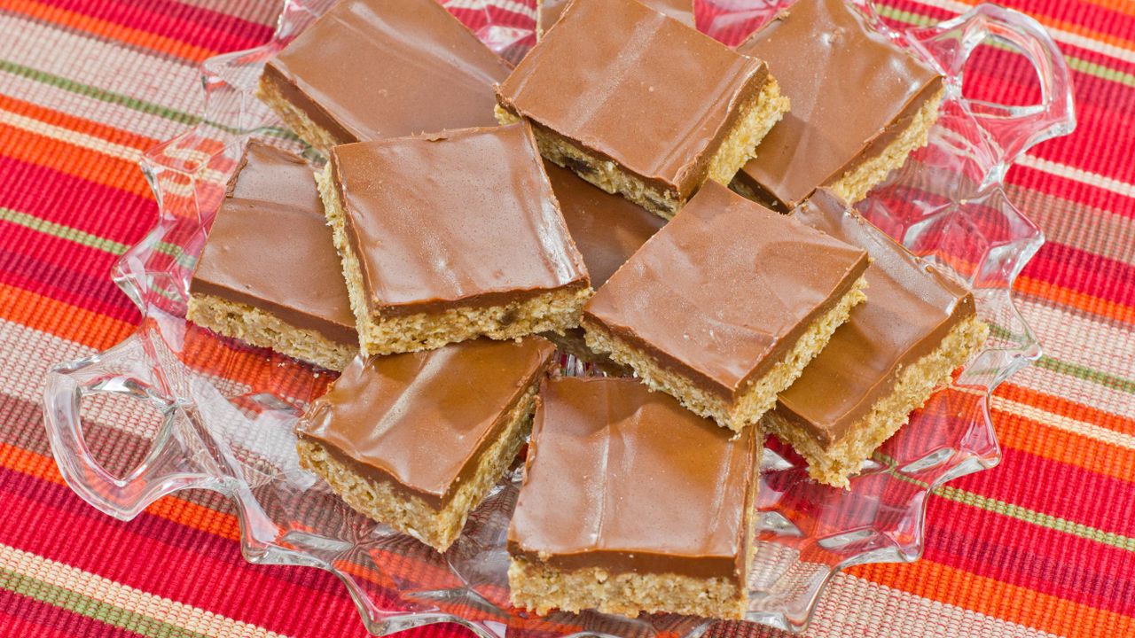 Chocolate oat bars on a glass cake stand