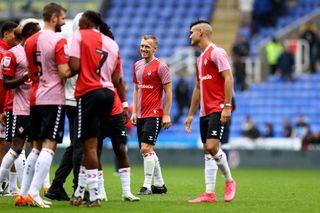 James Ward-Prowse of Southampton and Carlos Alcaraz(R) during the pre season friendly fixture between Reading FC and Southampton FC at the Select Car Leasing Stadium on July 22, 2023 in Reading, England.