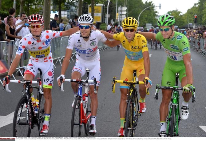 The four jersey winners all embrace at the start of stage 21