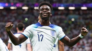 Bukayo Saka celebrates his goal for England against Senegal at the 2022 World Cup.