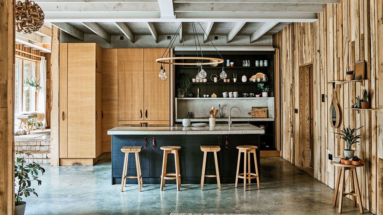 Rustic kitchen in lighting designer Tom Raffield&#039;s Cornish timber home