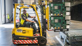 Stock image of a fork lift carrying oversized Raspberry Pi
