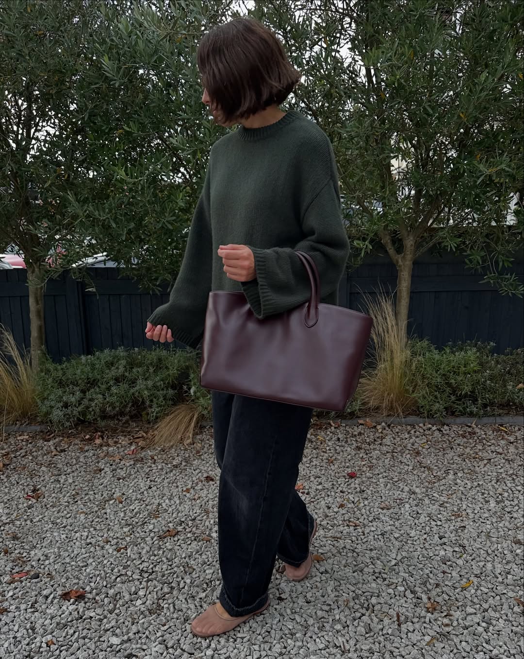 Lucy Alston in a green sweater