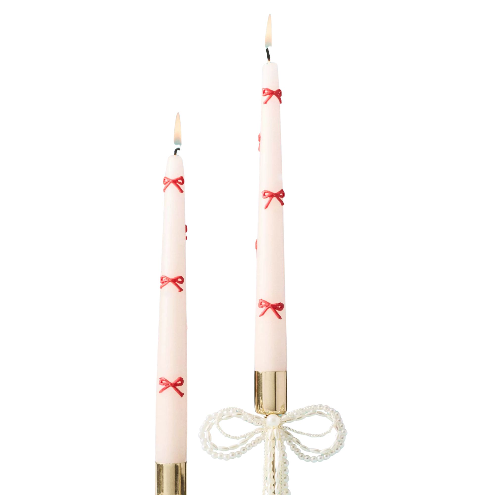 White taper candles with red bows