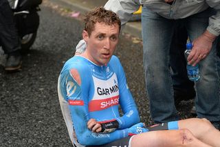 Daniel Martin sits stunned on the ground after crashing in the Giro d'Italia team time trial