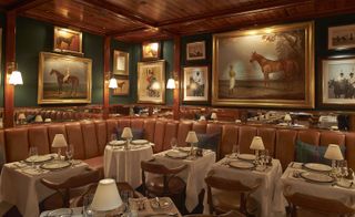 Bar with decorative table lamps and photoframes on wall