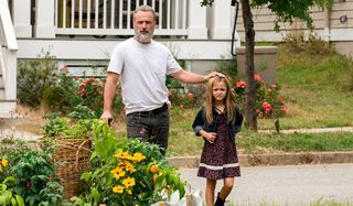 Andrew Lincoln as Rick Grimes and Kinsley Isla Dillon as Judith Grimes on AMC's The Walking Dead