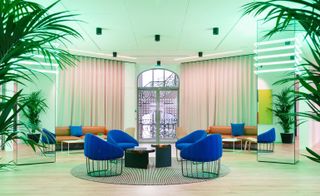 WeWork's space in Champs-Élysées, Paris has a dreamy atmosphere of soft lights and planting