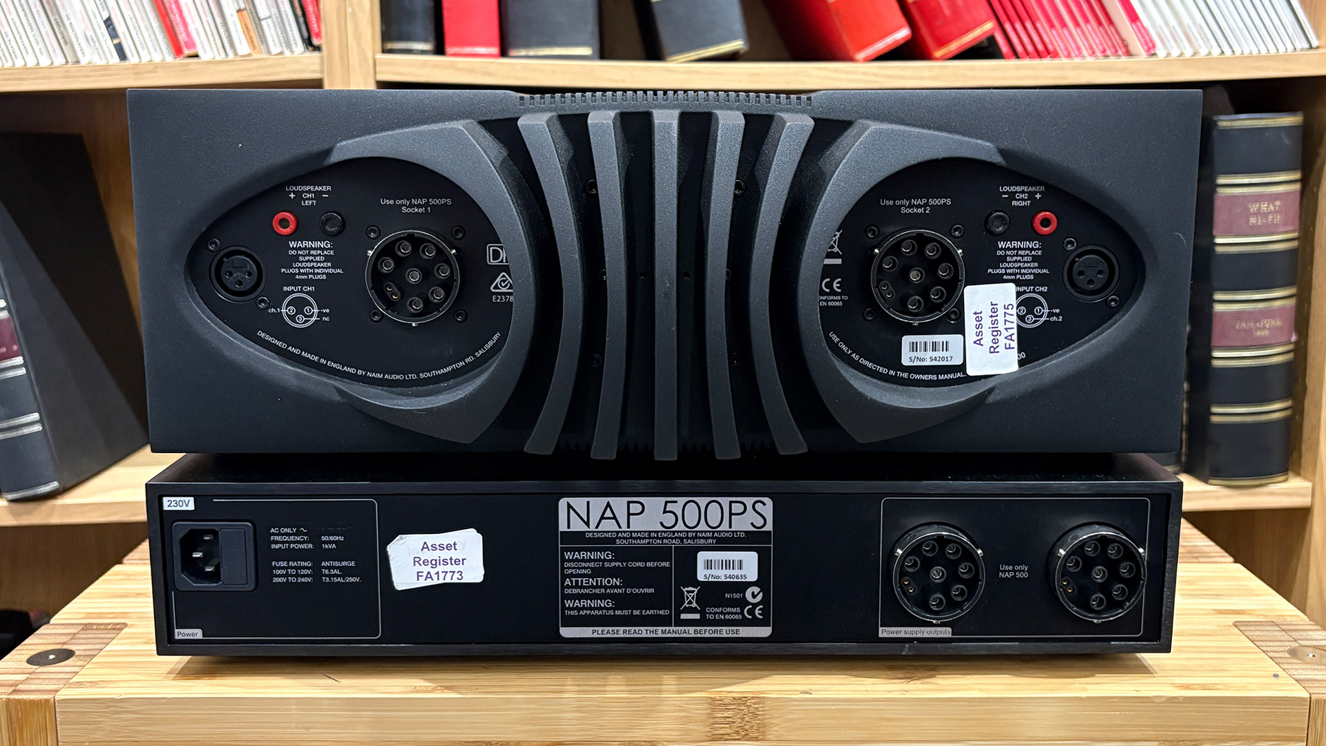 NAP 500 DR power amplifier rear of units on wooden hi-fi rack in front of bookcase