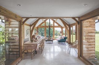A bright and spacious timber frame living room with expansive glazing