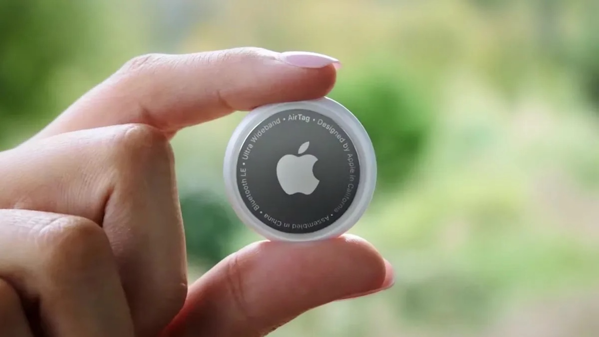 Apple Air Tag being held