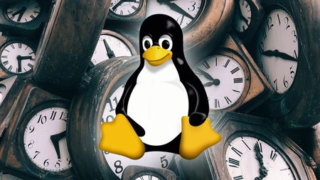 Linux logo in front of clocks