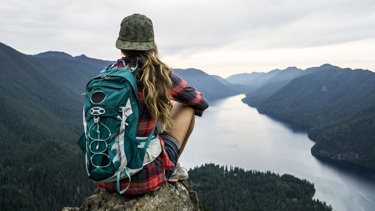 buy a hat: woman wearing cap above lake