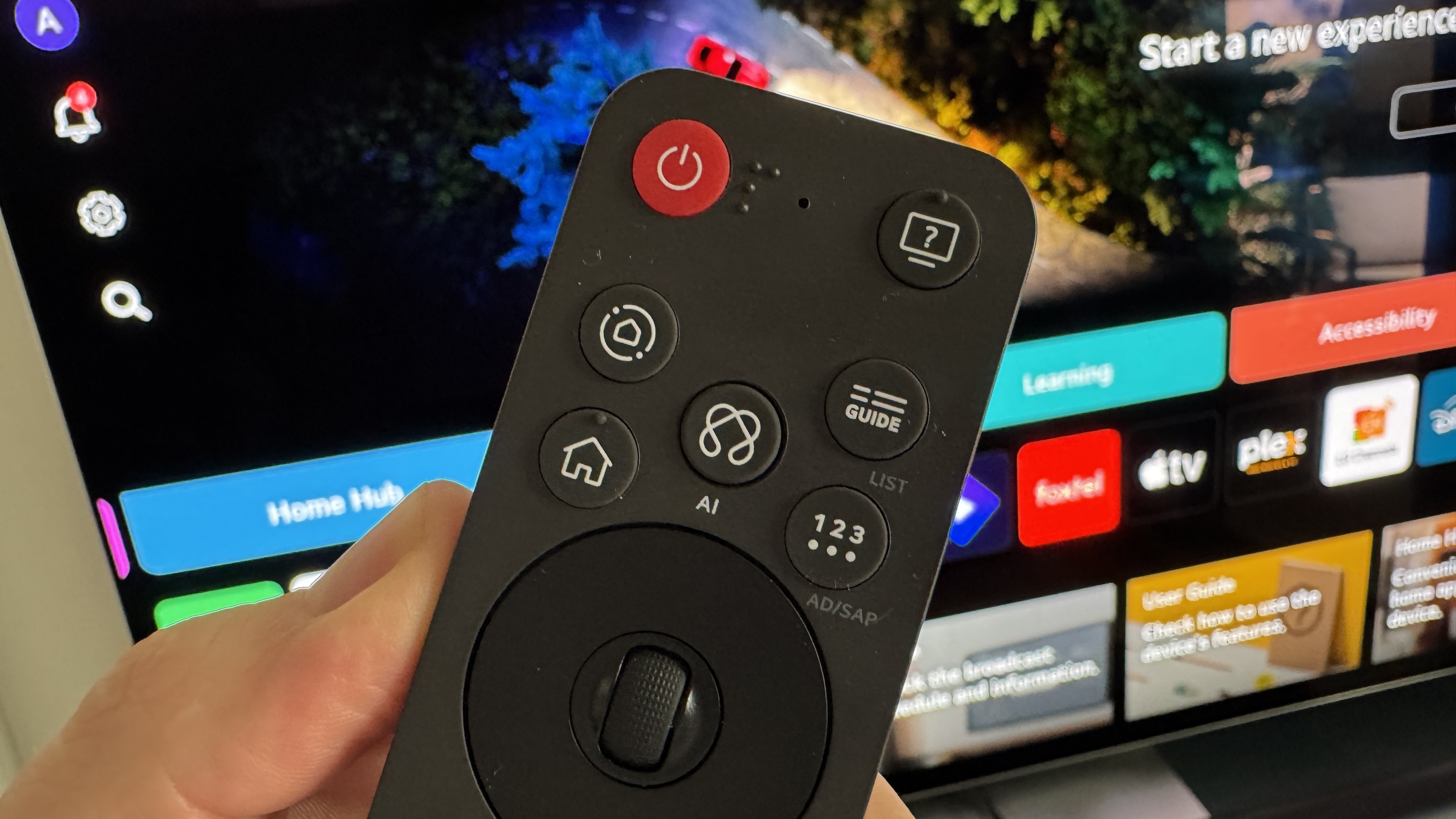 A close up image of the top section of LG's new Magic Remote, showing the central AI button.