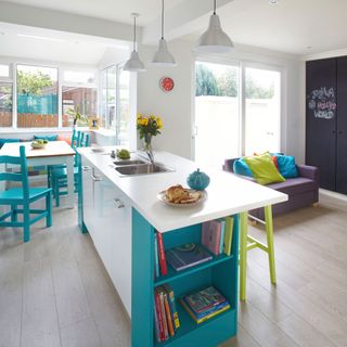 open plan kitchen with table and chair and counter