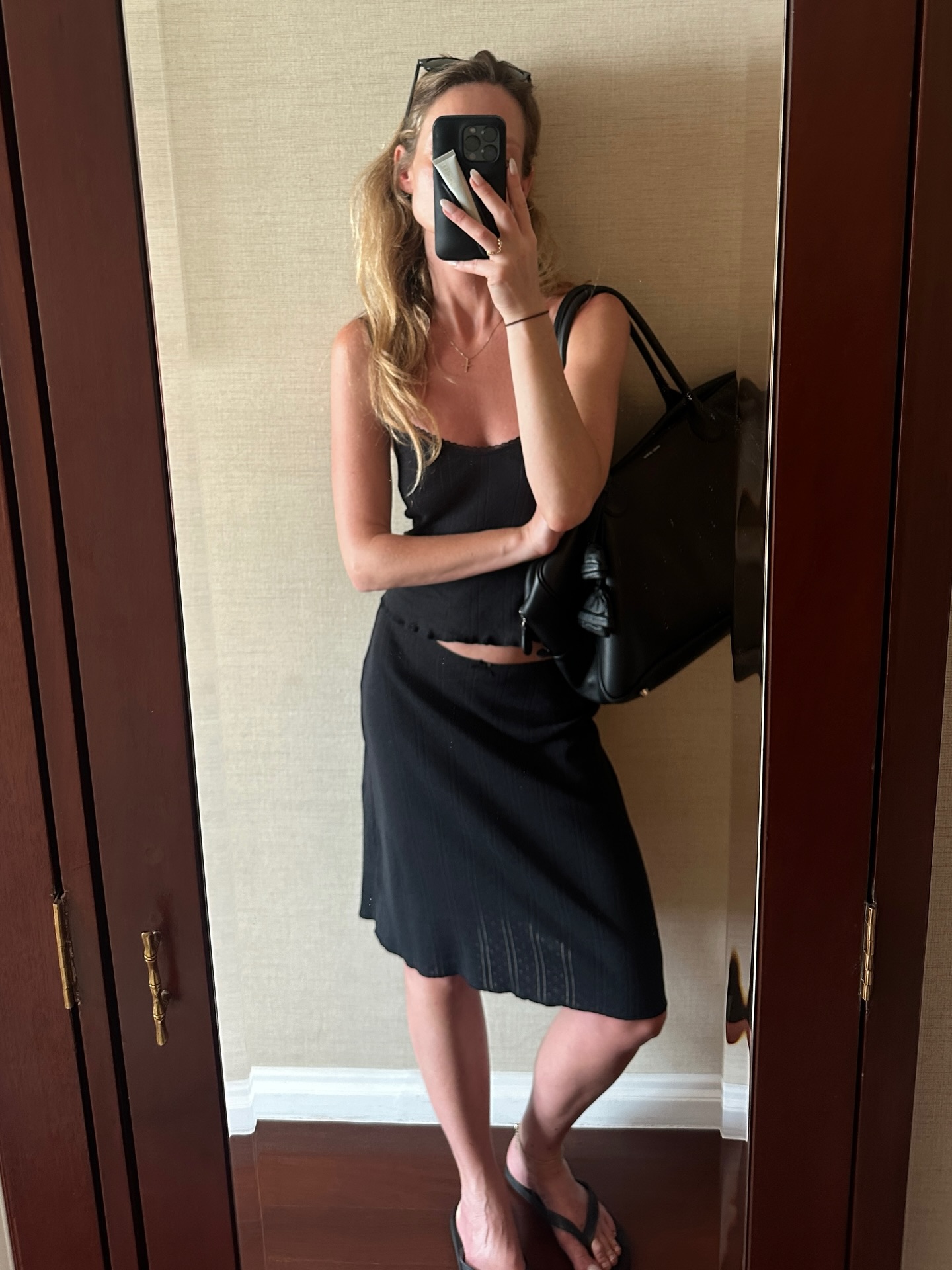 An image of a woman wearing summer knee length skirt outfit 2026