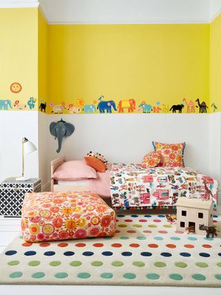 kids bedroom with white and yellow colour blocked walls and animal themes wall stickers by villa nova