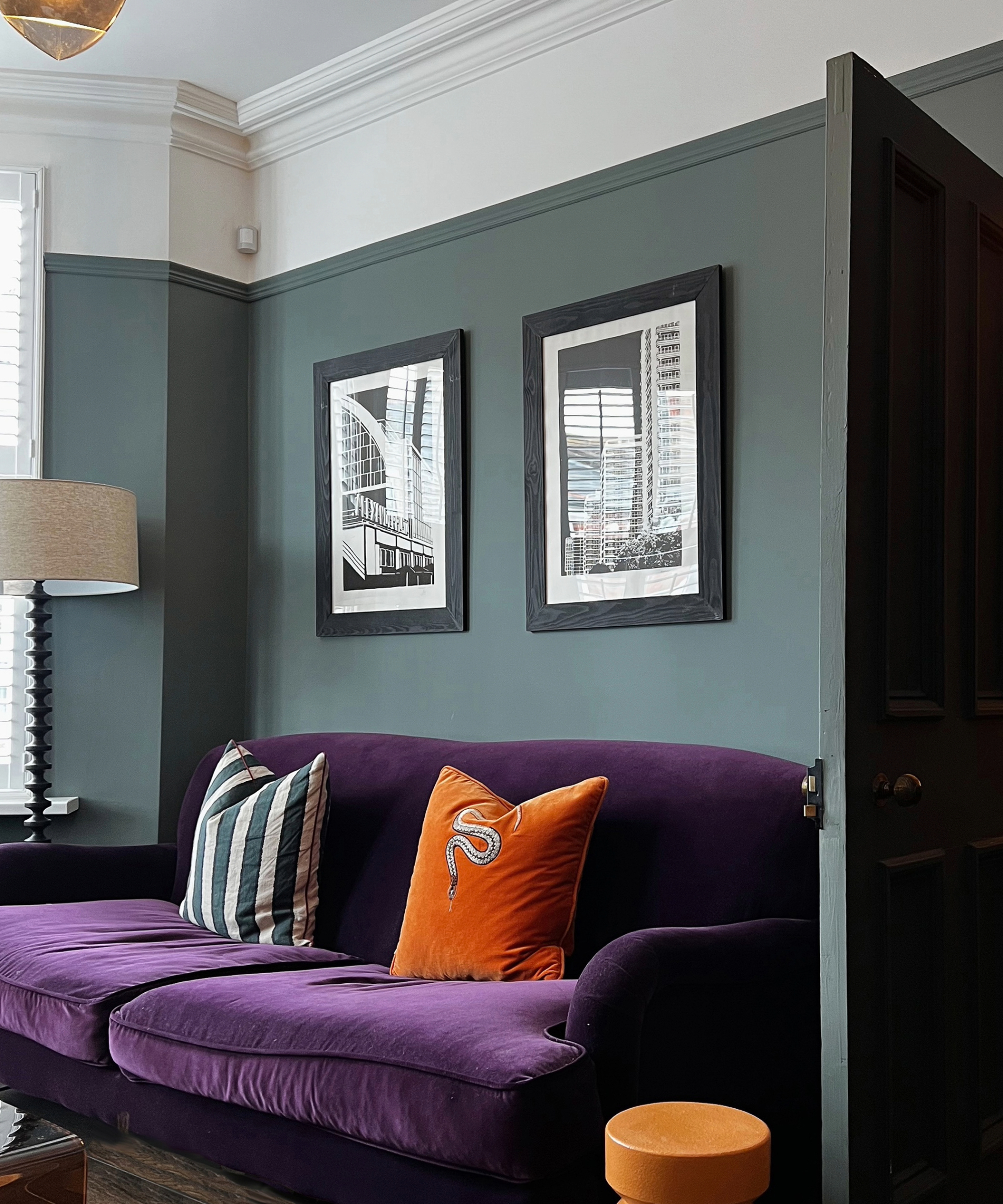 Green living room with a purple couch