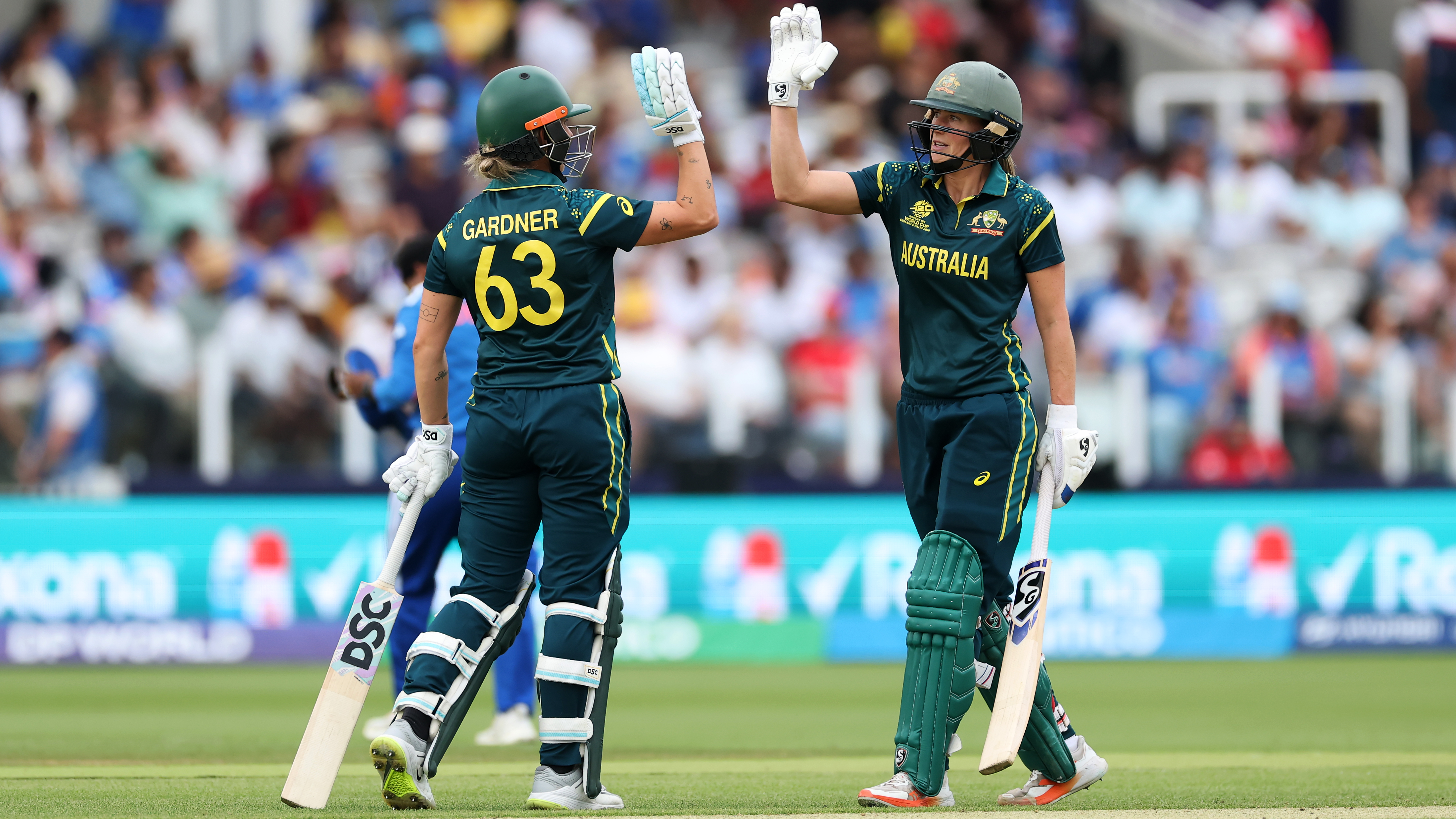 Ashleigh Gardner of Australia celebrates her fifty runs with Ellyse Perry during the ICC Women's T20 World Cup match between Australia and India