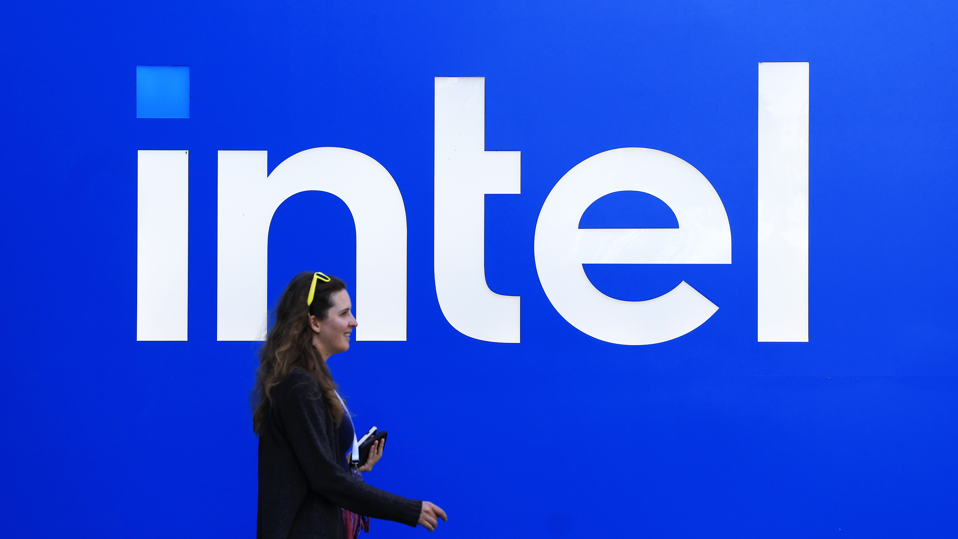 SANTA CLARA, CALIFORNIA - JULY 16: The Intel logo is displayed on a sign in front of Intel headquarters on July 16, 2025 in Santa Clara, California. Intel is laying off nearly 4,000 employees in offices across the United States in the coming weeks as part of a company-wide cost-cutting push led by new CEO Lip-Bu Tan. (Photo by Justin Sullivan/Getty Images)