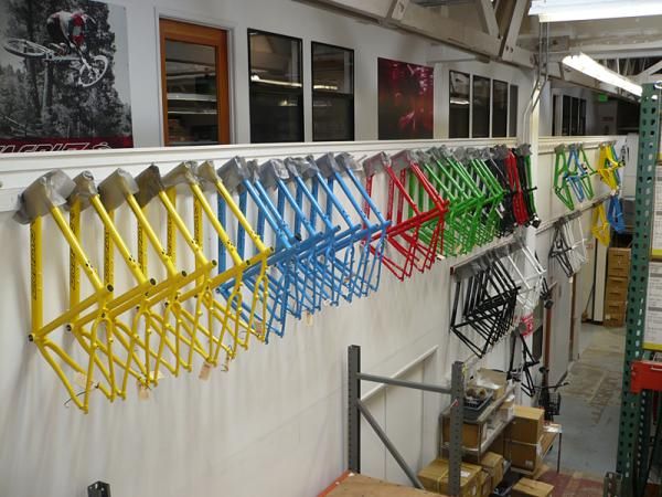 Santa Cruz bikes all lined up in a row.