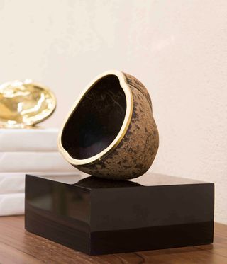 ‘Cigass’, a work in brass and coconut shell.