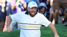 Shane Lowry celebrates holing the putt that won the Ryder Cup for Team Europe