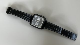 The TAG Heuer Monaco Night Drive on a grey background