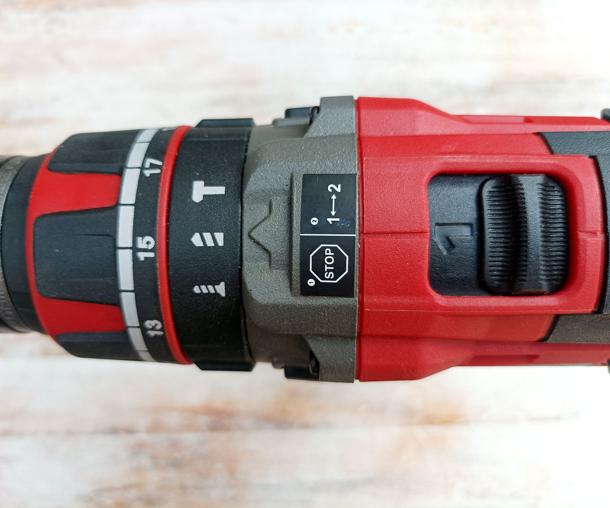 Top down shot of red Einhell Cordless drill showing selectors, gears and torques settings