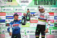 COMO ITALY OCTOBER 12 LR Remco Evenepoel of Belgium and Team Soudal QuickStep on second place and race winner Tadej Pogacar of Slovenia and UAE Team Emirates pose and celebrate on the podium ceremony after the 118th Il Lombardia 2024 a 255km one day race from Bergamo to Como UCIWT on October 12 2024 in Como Italy Photo by Tim de WaeleGetty Images