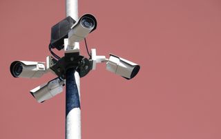 Four security cameras mounted on a pole
