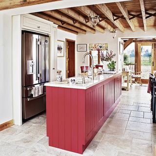 country kitchen diner with red island unit