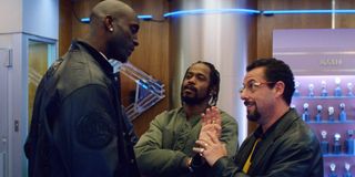 Uncut Gems Kevin Garnett talks to Adam Sandler, while Lakeith Stanfield watches, in the jewelry stor