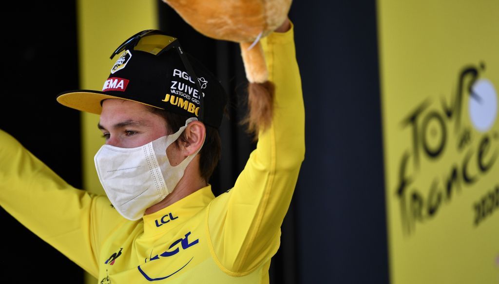 Team Jumbo rider Slovenias Primoz Roglic celebrates his overall leader yellow jersey on the podium at the end of the 18th stage of the 107th edition of the Tour de France cycling race 168 km between Meribel and La Roche sur Foron on September 17 2020 Photo by AnneChristine POUJOULAT POOL AFP Photo by ANNECHRISTINE POUJOULATPOOLAFP via Getty Images
