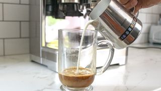 Pouring milk into coffee