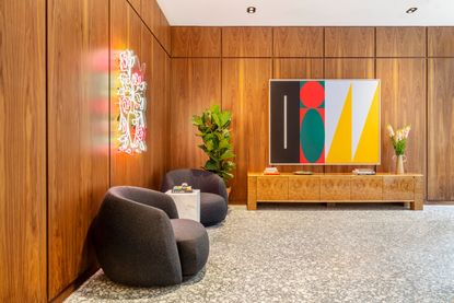 WeWork Meravigli interior with wood cladding and colourful art