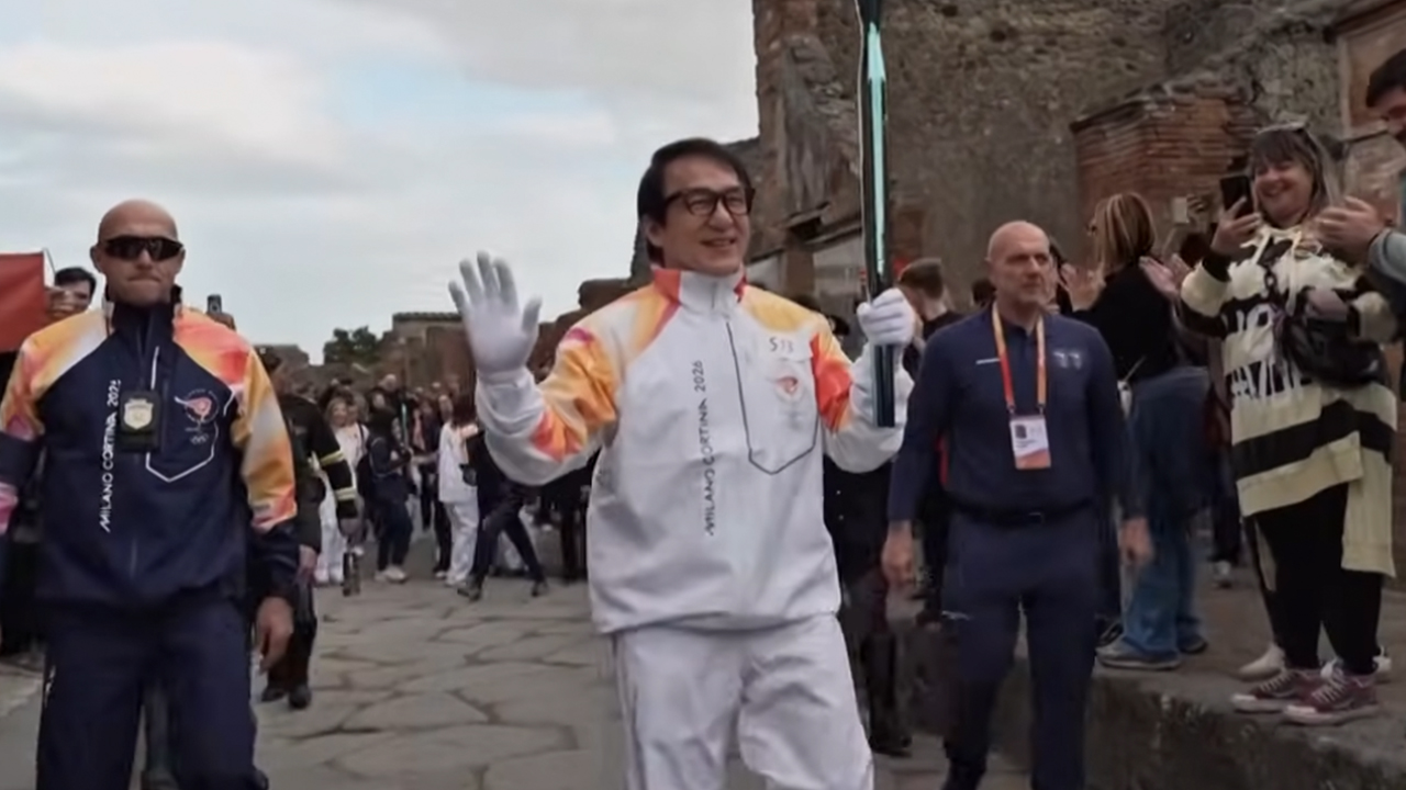 Jackie Chan carrying the Olympic torch.