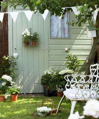 garden with bunting white flower plant white chair